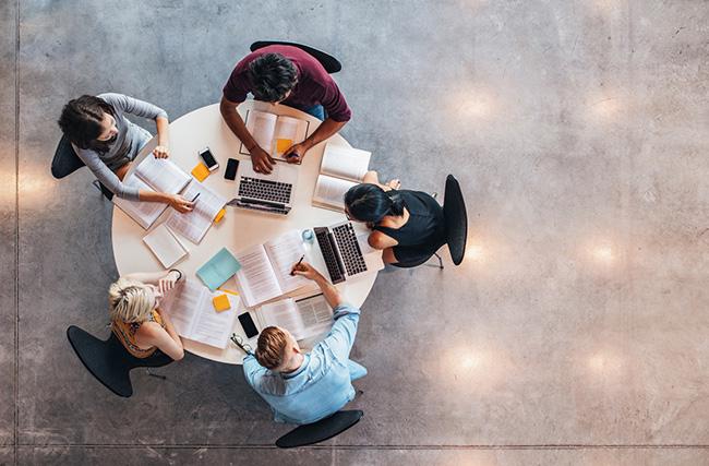 A group of students studying around a table