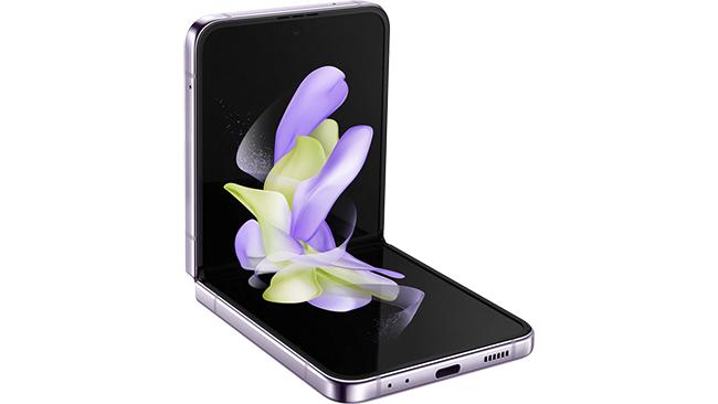The Samsung Galaxy Z Flip4 5G half flipped. It's sort of sitting on a white sheet looking a bit like a chair without any legs