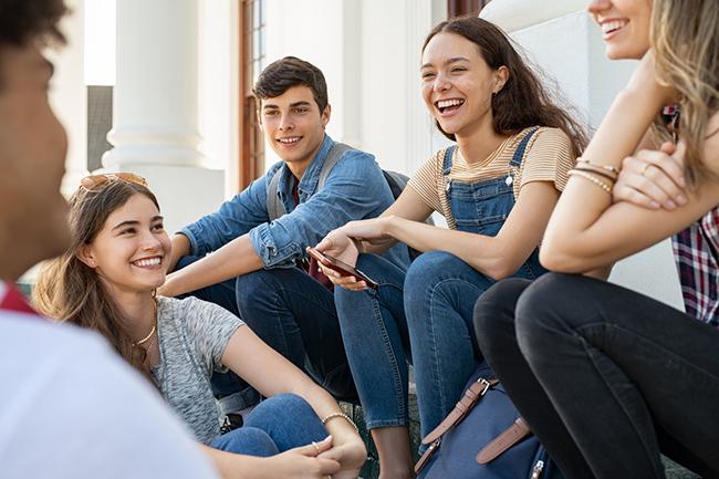 group of young people smiling and laughing