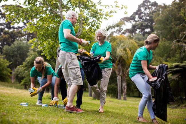 Group of people cleaning up rubbish.