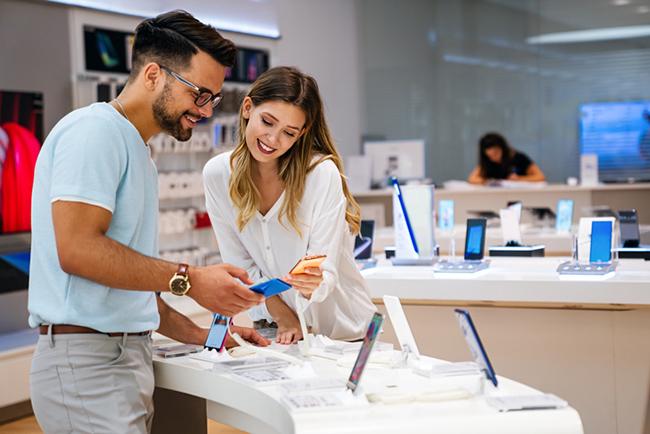 woman helping man with iphone